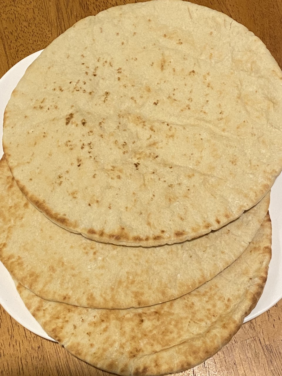 three pieces of fresh pita bread 